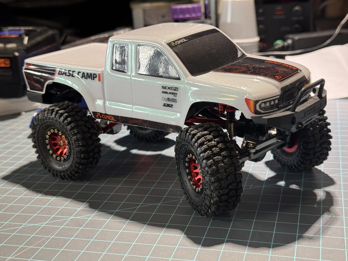SCX24 Base Camp with white body and red beadlock wheels
